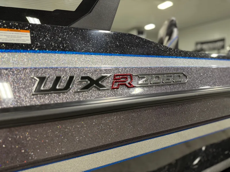 Slide: The Image of Close-up of the Skeeter WXR2060 with sparkling metallic finish and model badge. - 32