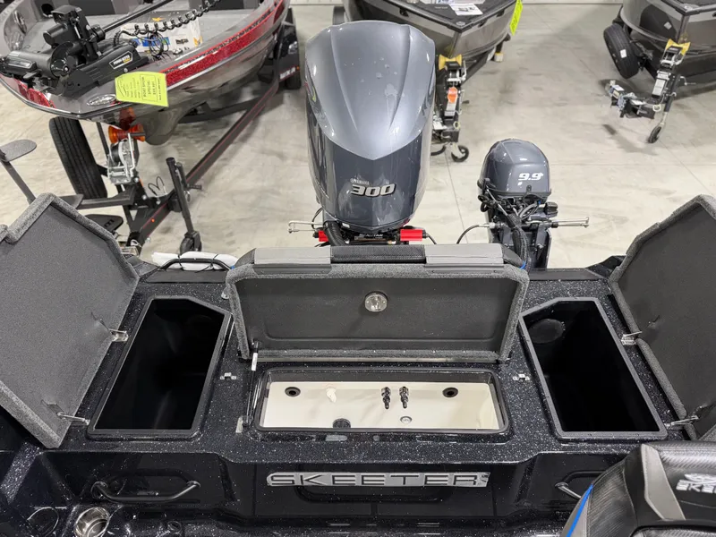 Slide: The Image of 2026 Skeeter WXR2060 with a powerful outboard motor and spacious storage compartments. - 29