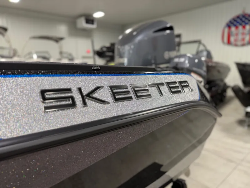 Slide: The Image of Close-up of the Skeeter WXR2060 with a glittering hull in a showroom. - 33