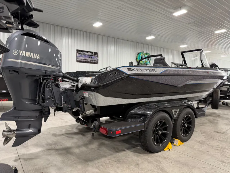 Slide: The Image of A 2026 Skeeter WXR2060 boat is on a trailer in a warehouse. - 8