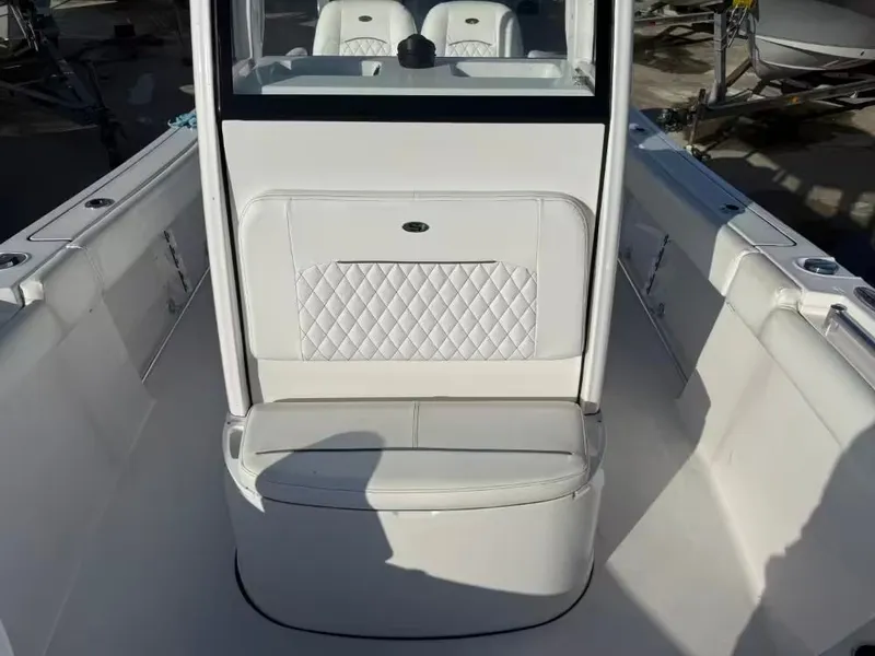Slide: The Image of The image shows the interior of a 2025 Sportsman Open 232 Center Console boat. - 15