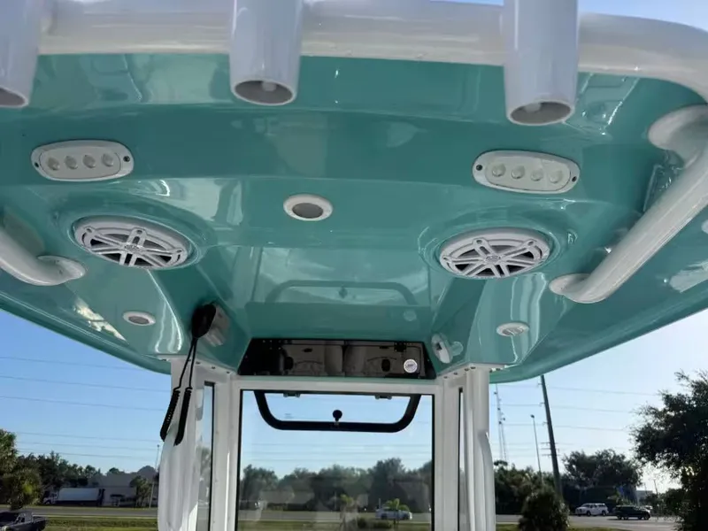 Slide: The Image of The image shows the roof of a Sportsman Open 232 Center Console boat with speakers and lights. - 11