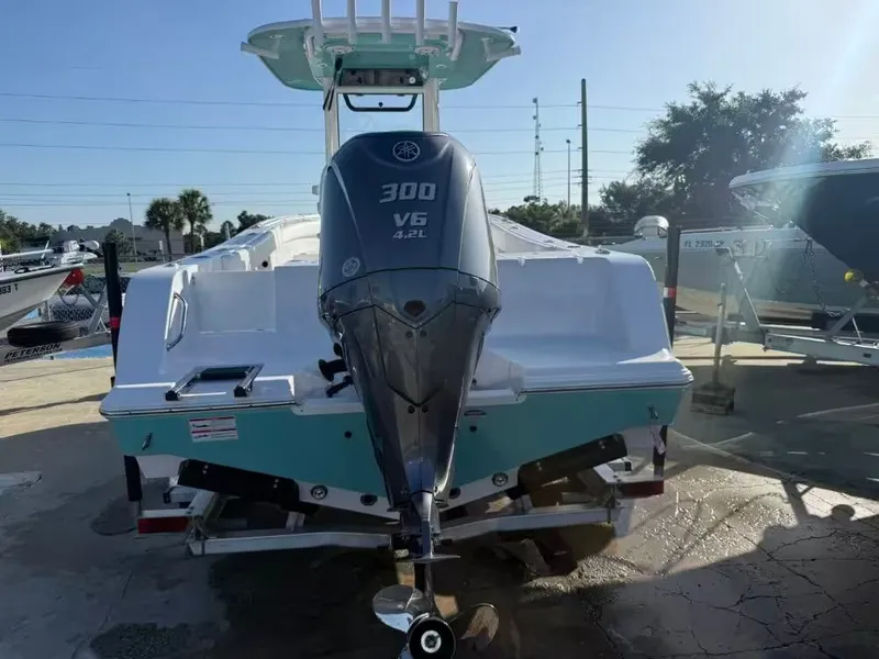 Slide: The Image of Rear view of a Sportsman Open 232 Center Console boat with a 300 HP outboard motor. - 5
