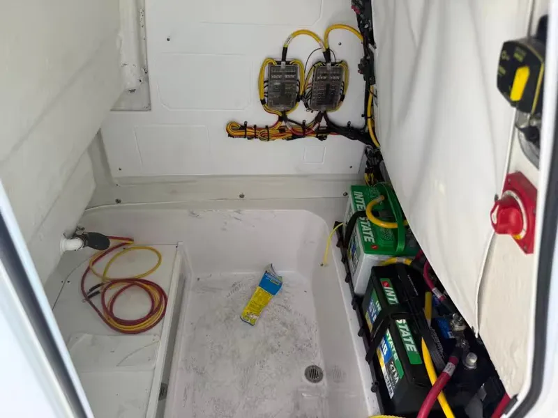 Slide: The Image of View of a boat's technical compartment with batteries and wiring. - 19