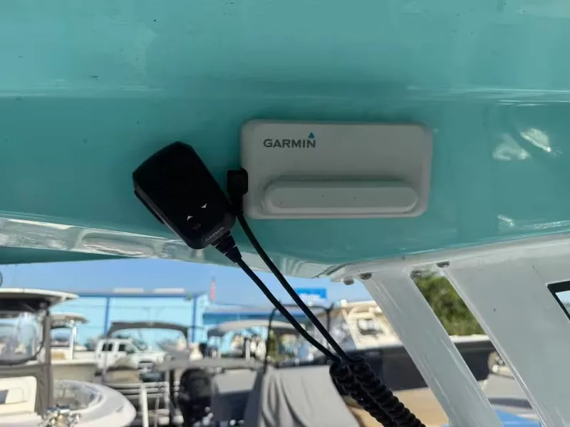Slide: The Image of A Garmin device is mounted on the ceiling of a Sportsman Open 232 Center Console boat. - 12