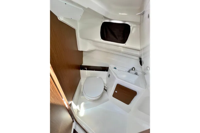 Slide: The Image of 2023 Beneteau Antares 8 boat interior bathroom with toilet and sink. - 76