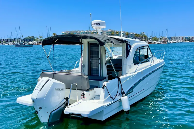 Slide: The Image of 2023 Beneteau Antares 8 boat on water, featuring sleek design and Mercury outboard engine. - 7