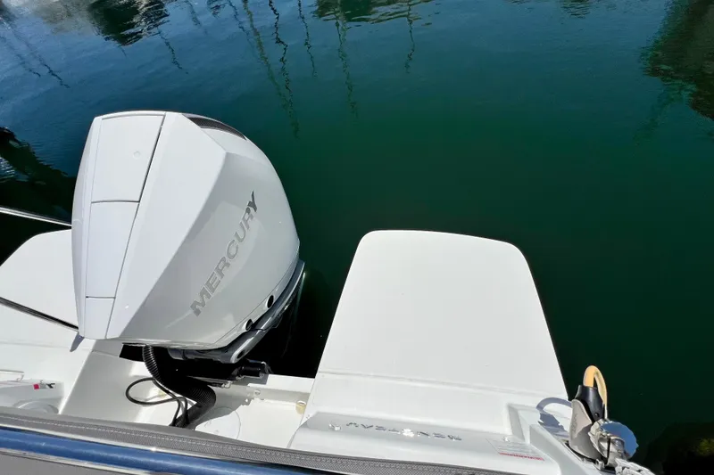 Slide: The Image of 2023 Beneteau Antares 8 with Mercury outboard engine on calm water. - 36