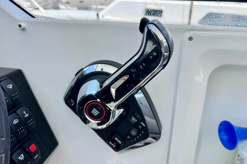 Slide: The Image of Throttle control of 2023 Beneteau Antares 8 boat, featuring start/stop button. - 58