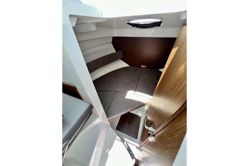 Slide: The Image of Interior cabin of 2023 Beneteau Antares 8, featuring cozy sleeping quarters and wooden accents. - 70