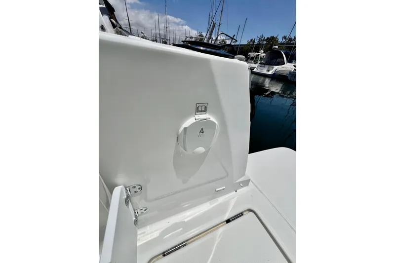 Slide: The Image of 2023 Beneteau Antares 8 boat detail, featuring a sleek white exterior in a marina setting. - 38