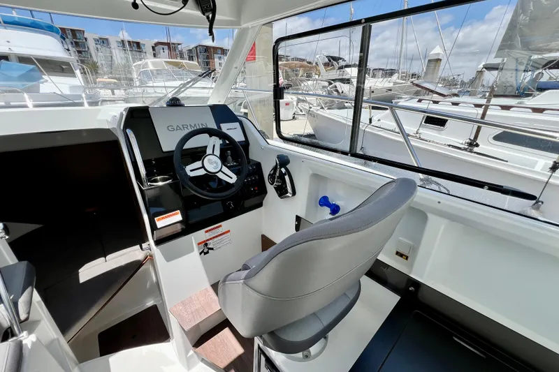 Slide: The Image of Interior cockpit of 2023 Beneteau Antares 8 with Garmin navigation system. - 53