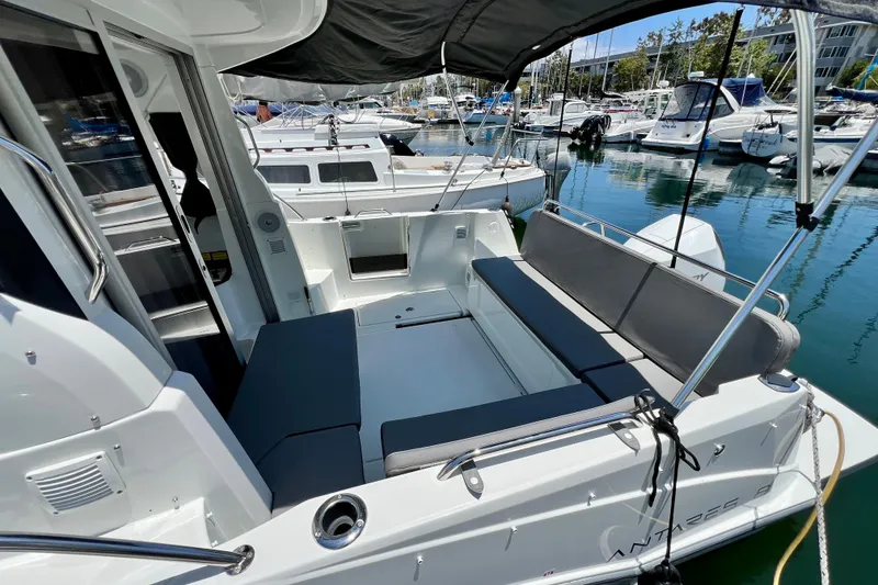 Slide: The Image of 2023 Beneteau Antares 8 boat interior with seating, docked at marina. - 34