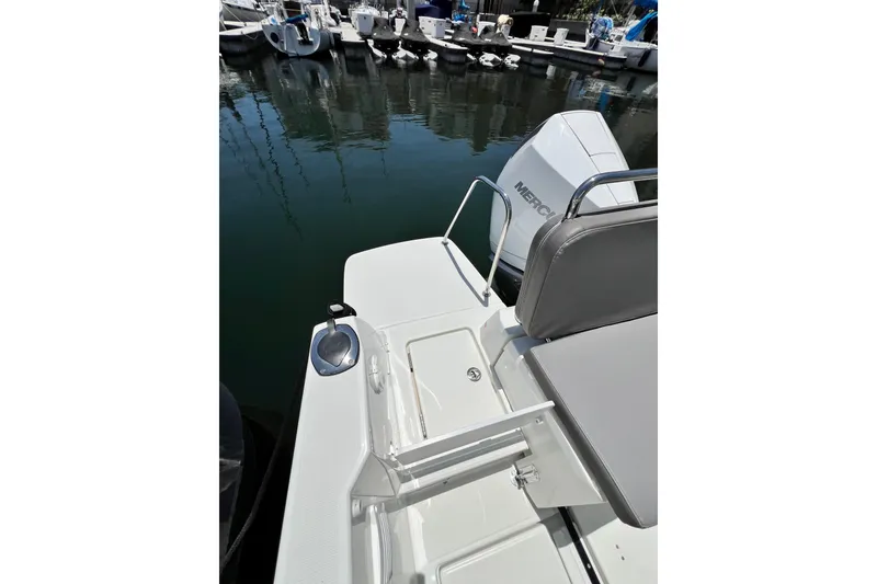 Slide: The Image of 2023 Beneteau Antares 8 boat stern with Mercury engine at marina. - 35