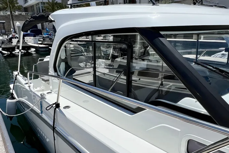 Slide: The Image of 2023 Beneteau Antares 8 docked, showcasing sleek design and modern features. - 19
