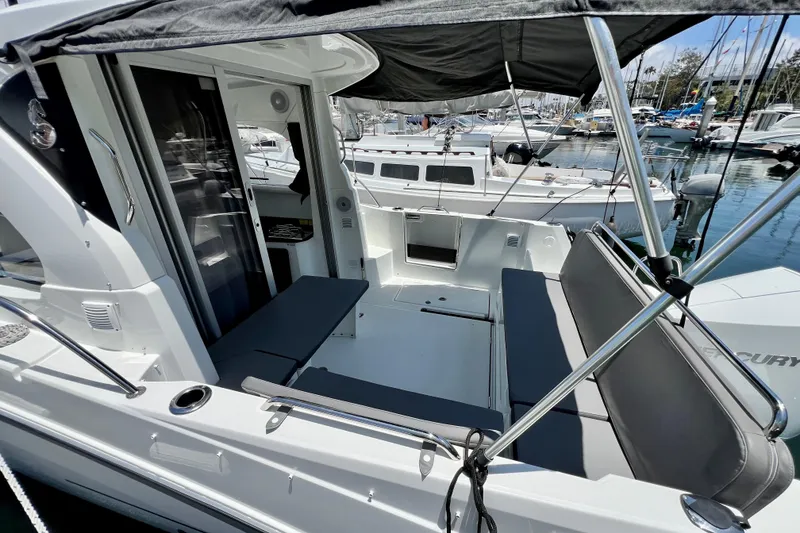 Slide: The Image of 2023 Beneteau Antares 8 boat interior with seating, docked at marina. - 33