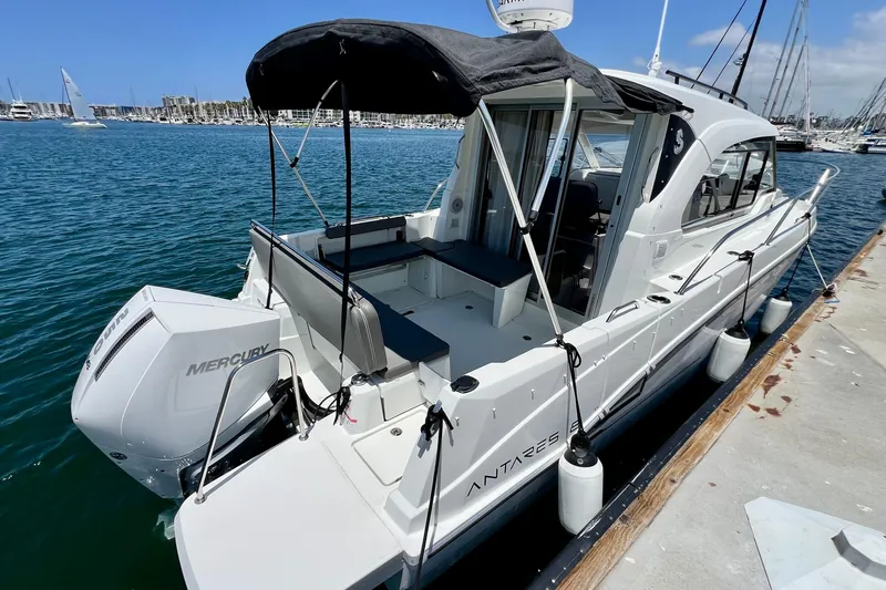 Slide: The Image of 2023 Beneteau Antares 8 boat docked, featuring Mercury engine and sleek design. - 13