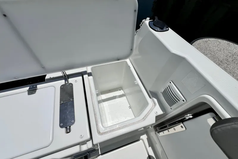 Slide: The Image of 2023 Beneteau Antares 8 boat interior storage compartment with open lid. - 41