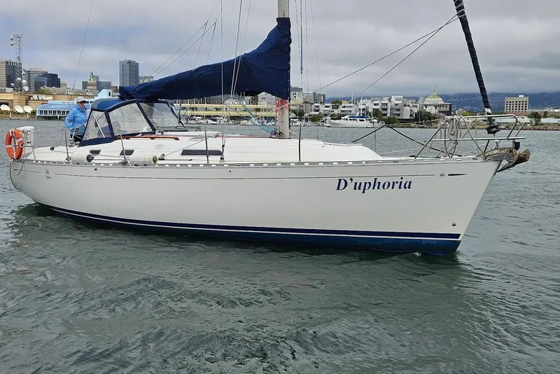 The Image of 2001 Dufour 36 Classic sailboat named D'uphoria on water near cityscape. - 0