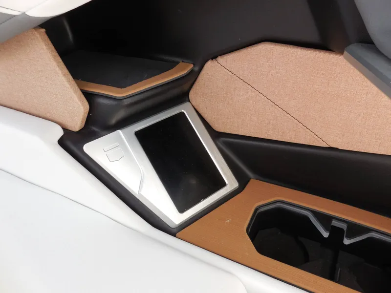 Slide: The Image of Close-up of a modern boat interior with a touchscreen and cup holders. - 21