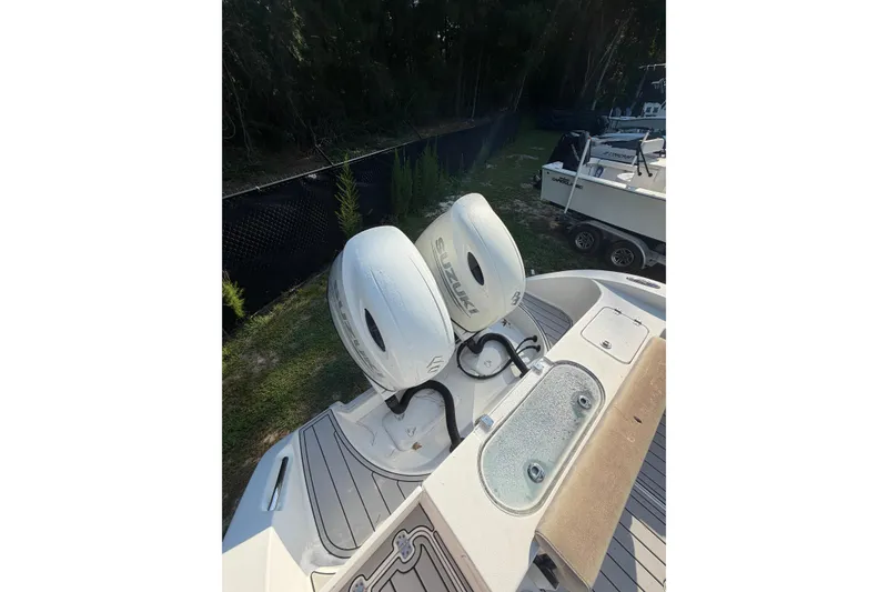 Slide: The Image of 2020 Sea Pro 259 Center Console with dual Suzuki outboard motors. - 12