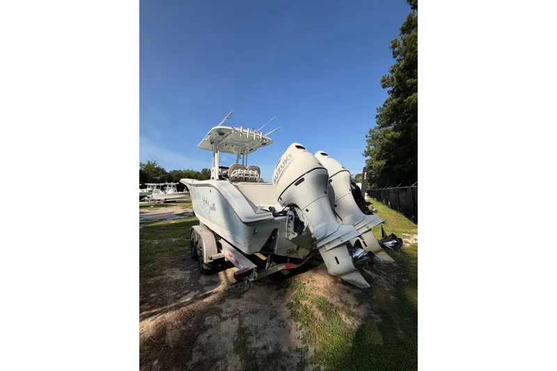 Slide: The Image of 2020 Sea Pro 259 Center Console boat with dual outboard engines on a trailer. - 11