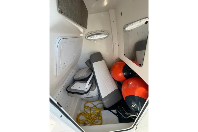 Slide: The Image of Interior of 2020 Sea Pro 259 Center Console with seats, buoys, and rope. - 13