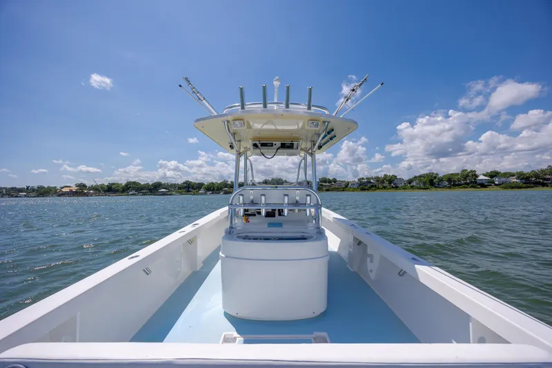 Slide: The Image of 2011 Albury Brothers 27 boat on water under clear blue sky. - 22