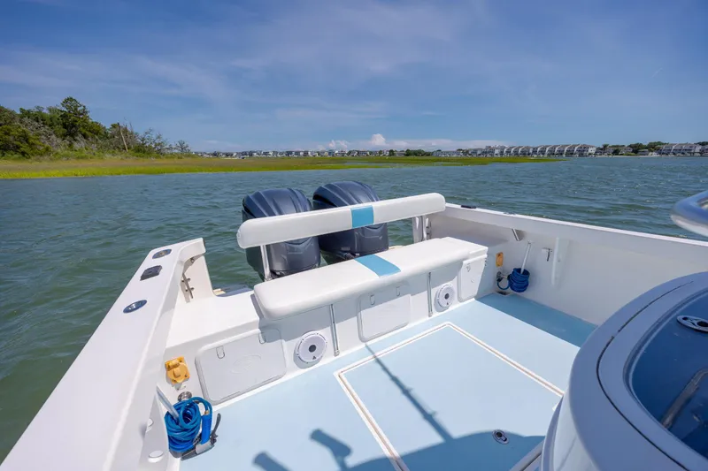 Slide: The Image of 2011 Albury Brothers 27 boat with dual engines on a sunny day. - 18