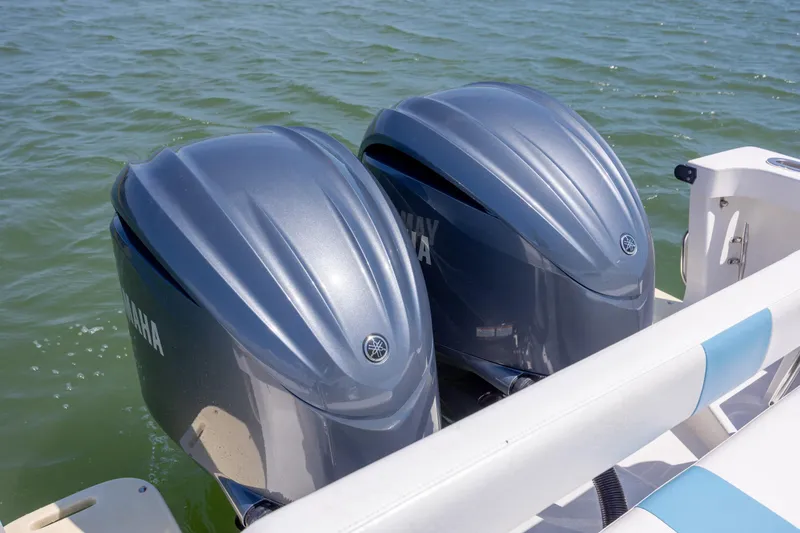 Slide: The Image of Twin Yamaha outboard motors on a 2011 Albury Brothers 27 boat in water. - 21