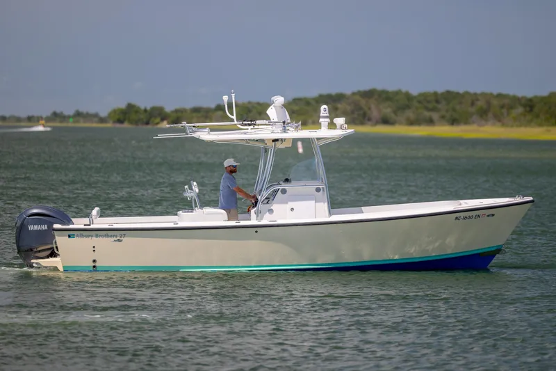 Slide: The Image of 2011 Albury Brothers 27 boat cruising on a calm lake with Yamaha engine. - 8
