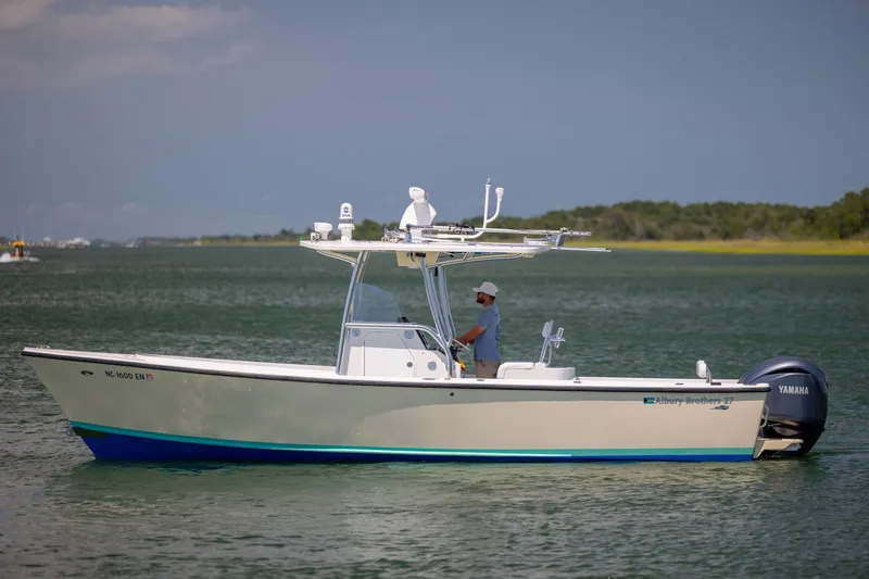 Slide: The Image of 2011 Albury Brothers 27 boat on water with Yamaha engine, man steering. - 4