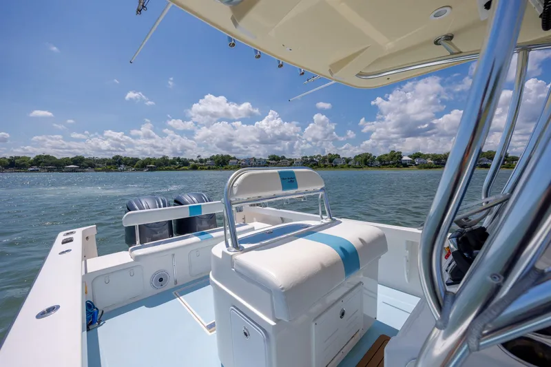 Slide: The Image of 2011 Albury Brothers 27 boat on water, sunny day, scenic shoreline view. - 13