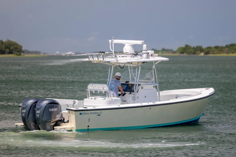 Slide: The Image of 2011 Albury Brothers 27 boat cruising on a calm waterway with dual Yamaha engines. - 7