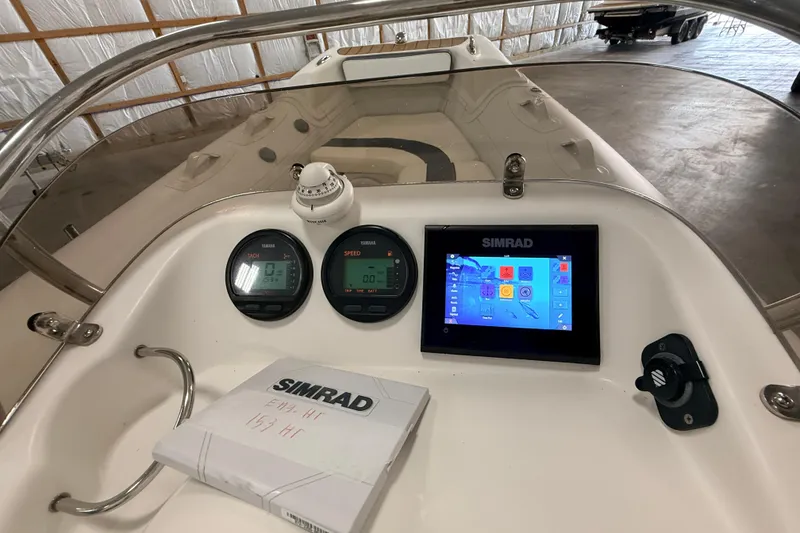 Slide: The Image of 2014 Walker Bay Generation 450 DLX dashboard with Simrad display and Yamaha gauges. - 19