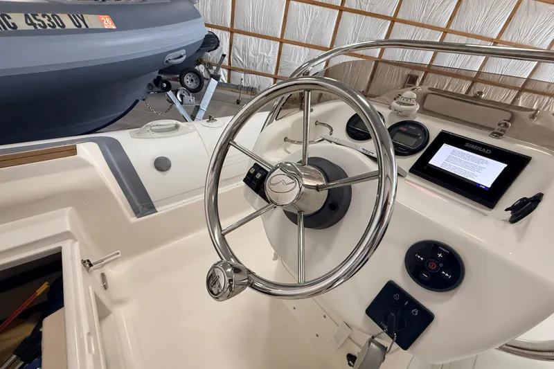 Slide: The Image of Steering console of 2014 Walker Bay Generation 450 DLX boat with navigation display. - 18