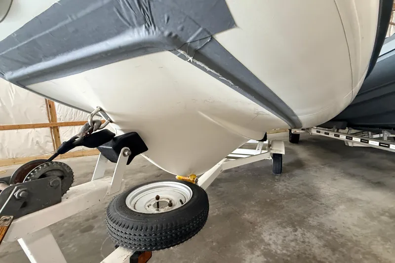 Slide: The Image of 2014 Walker Bay Generation 450 DLX boat on trailer in storage facility. - 24