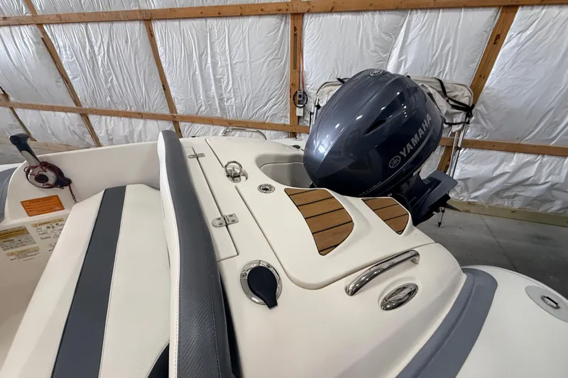 Slide: The Image of 2014 Walker Bay Generation 450 DLX boat with Yamaha engine in a garage. - 9