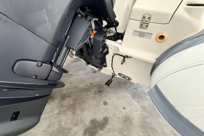 Slide: The Image of 2014 Walker Bay Generation 450 DLX boat engine detail in a garage setting. - 12