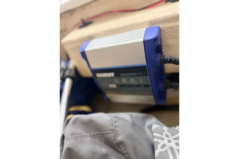 Slide: The Image of Battery charger installed on a 2014 Walker Bay Generation 450 DLX boat. - 16