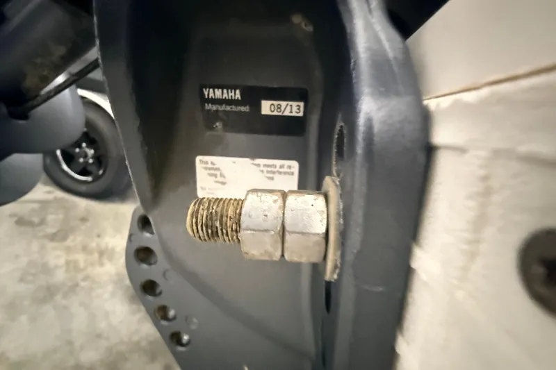 Slide: The Image of Close-up of a Yamaha engine part on a 2014 Walker Bay Generation 450 DLX boat. - 25