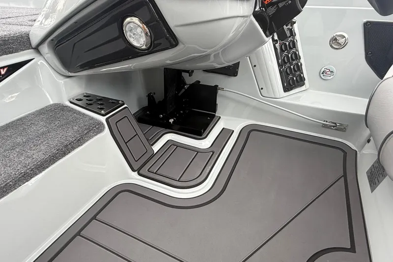 Slide: The Image of Interior of 2027 Phoenix 921 Elite X II boat, featuring sleek controls and modern design. - 15