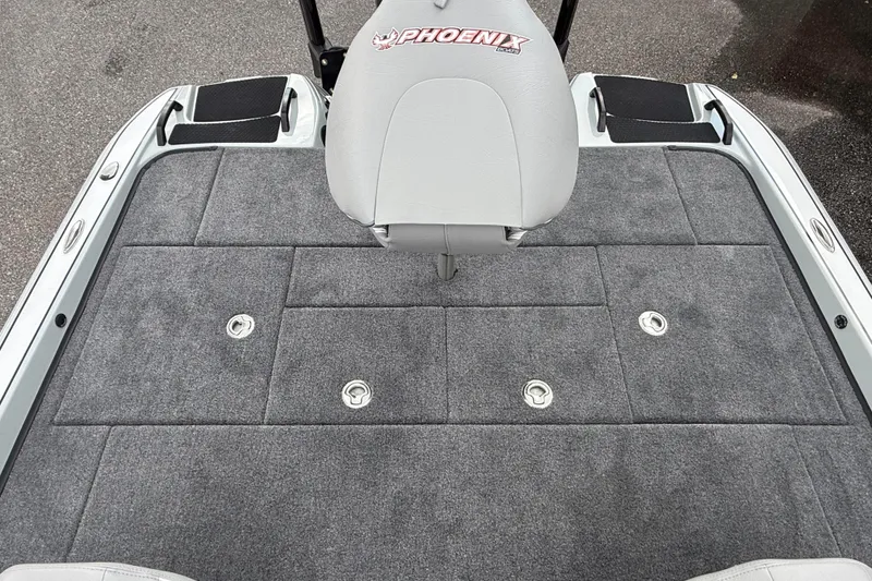 Slide: The Image of 2027 Phoenix 921 Elite X II boat deck with gray carpet and seat. - 12