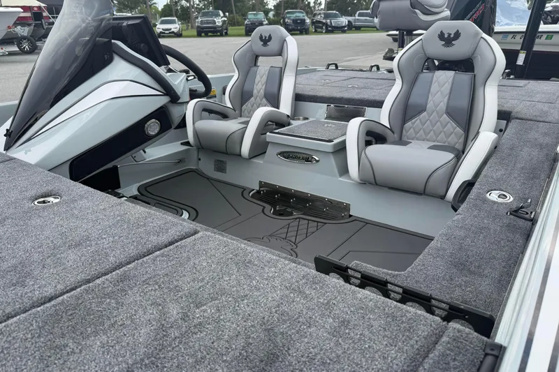 Slide: The Image of Interior of 2027 Phoenix 921 Elite X II boat with plush seating and modern dashboard. - 22