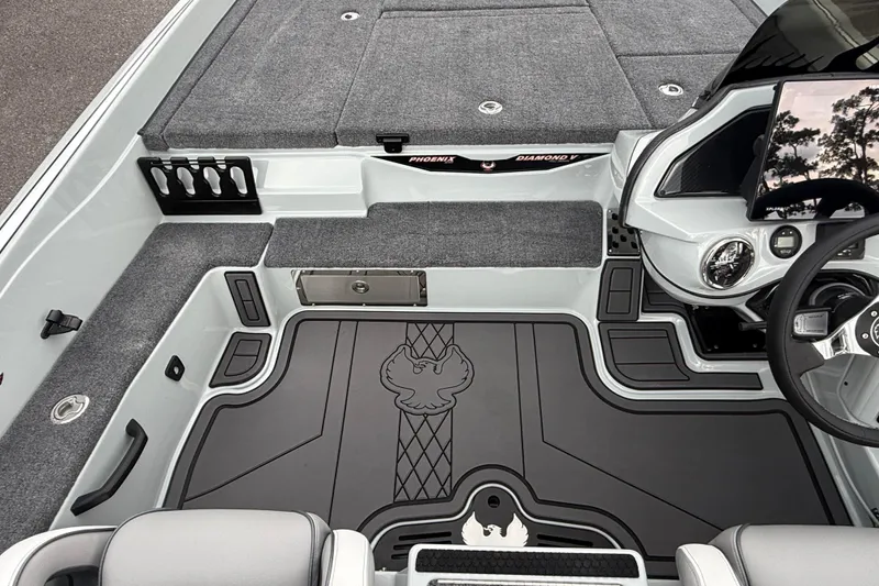 Slide: The Image of Interior of 2027 Phoenix 921 Elite X II boat with sleek design and advanced controls. - 18