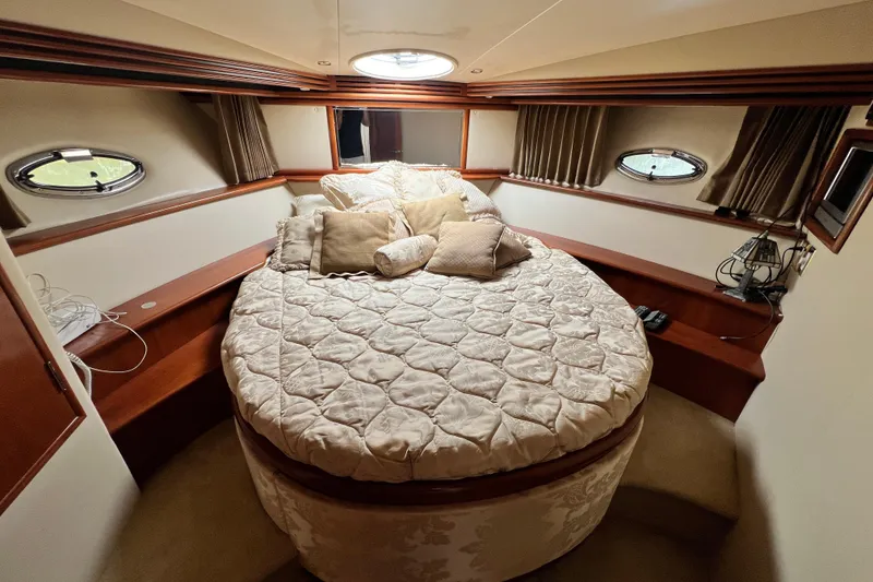 Slide: The Image of Luxurious bedroom interior of 2003 Carver 450 Voyager Pilothouse yacht with round bed. - 35
