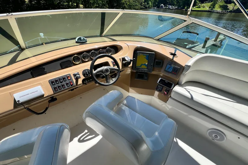 Slide: The Image of 2003 Carver 450 Voyager Pilothouse helm with navigation instruments and comfortable seating. - 41