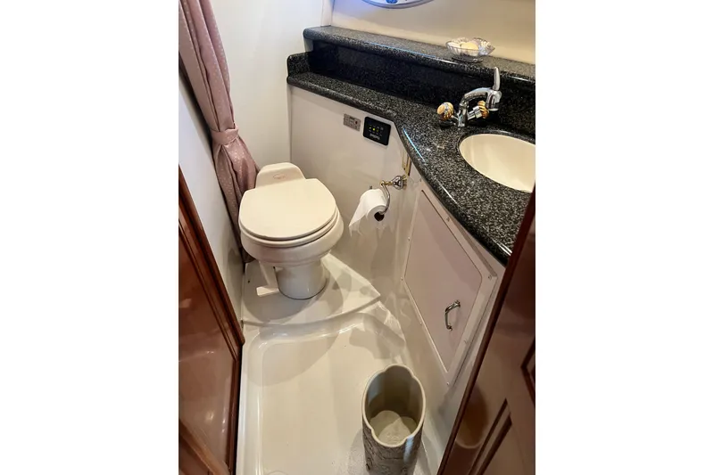 Slide: The Image of Bathroom interior of 2003 Carver 450 Voyager Pilothouse with toilet and sink. - 37