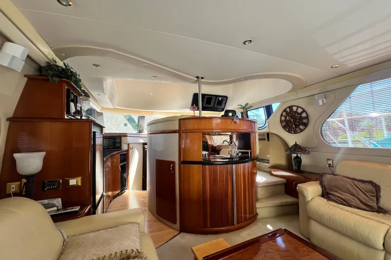 Slide: The Image of Luxurious interior of 2003 Carver 450 Voyager Pilothouse yacht with elegant wood finishes. - 12