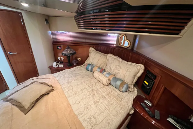 Slide: The Image of Luxurious bedroom interior of 2003 Carver 450 Voyager Pilothouse yacht with elegant bedding. - 28